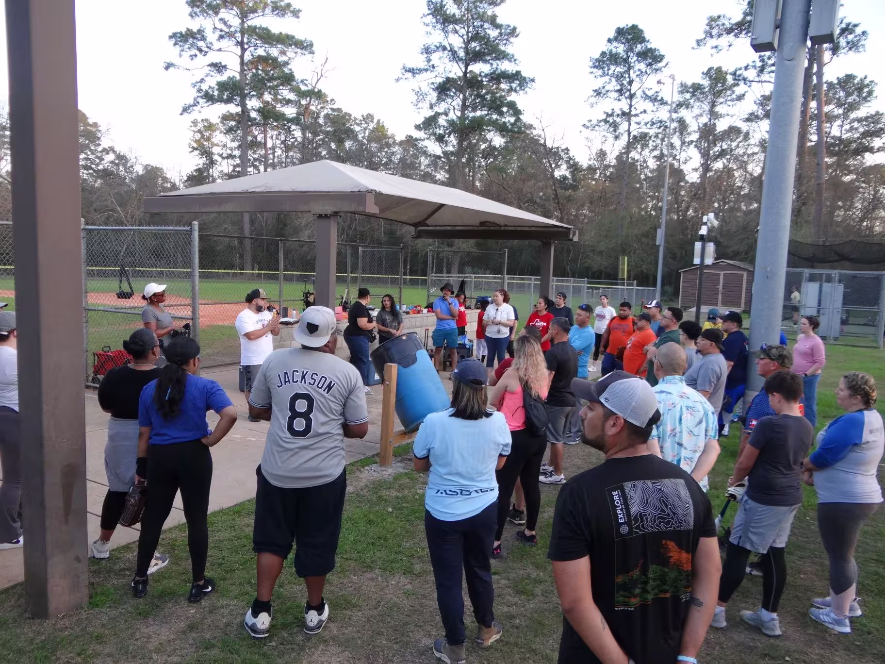 Several people gathered, going over the weekly lesson