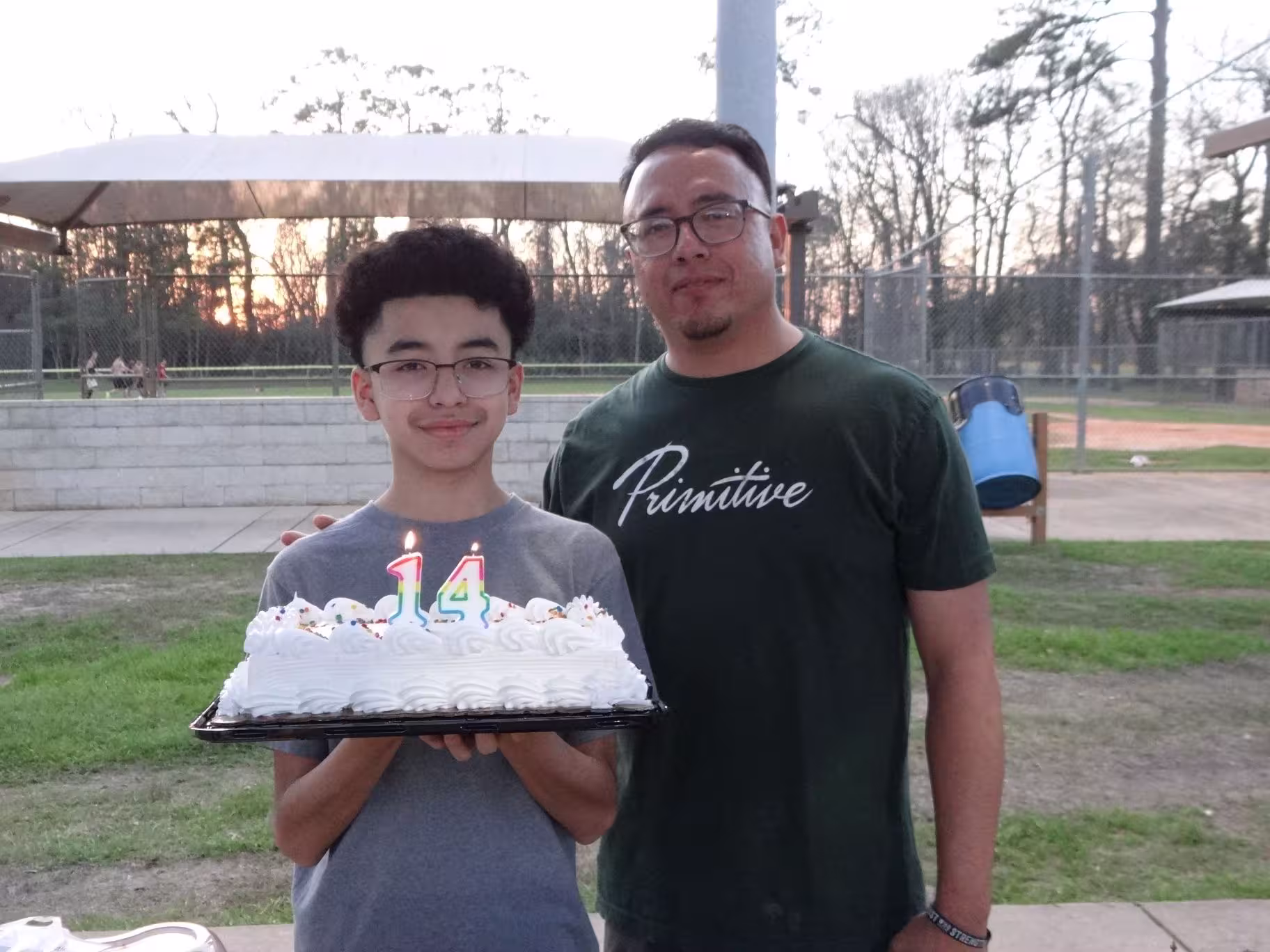 Father and son celebrating the sons birthday.